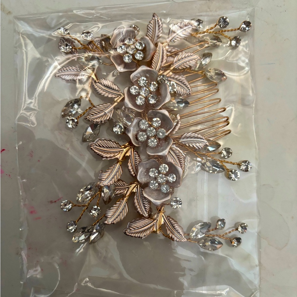 Rose gold hair clip with Swarovski crystals, never worn, still in the package.